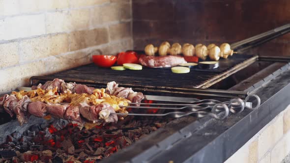 Cooking meat on fire. Grilling marinated meat on grill