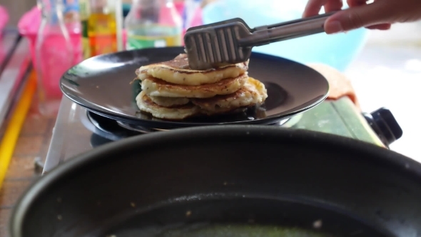 Close Up Of Cooking Pancakes On Hot Frying Pan For