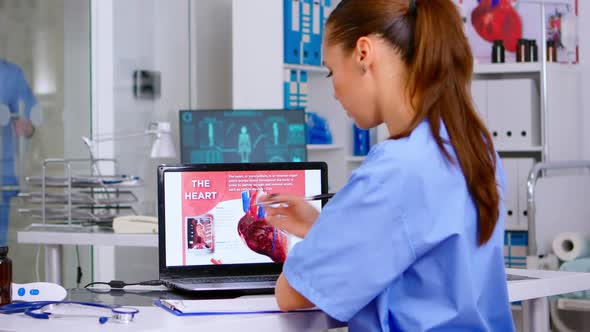 Assistant Expertise Doctor in Medical Uniform Examining Heart Disease