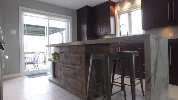 kitchen island with custom barn wood reveal slide from behind wall