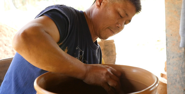 Man Working On Pottery Wheel