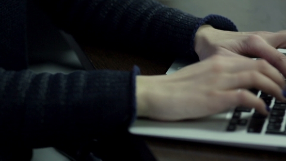 Woman Hand Typing On Laptop Keyboard alt
