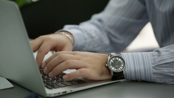 Man Is Typing On Laptop Keyboard  Shallow Depth Of alt