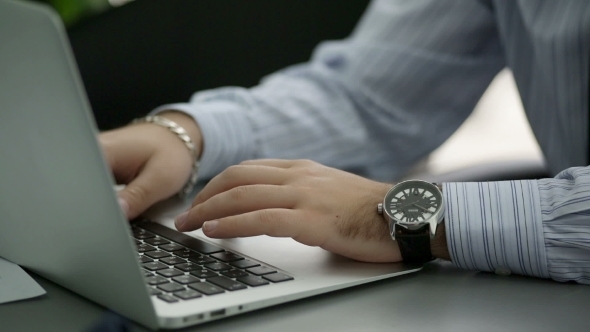 Man Is Typing On Laptop Keyboard  Shallow Depth Of alt