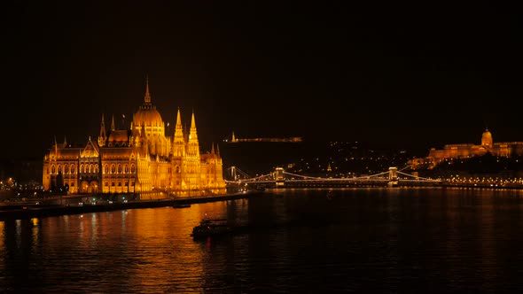 National parliament building of Hungary by the night on river Danube 4K 2160p 30fps UltraHD footage 