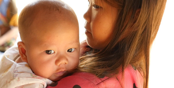 Kid Holding Baby alt