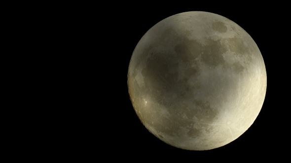 Lapse of a Large Full Golden Moon in Clouds