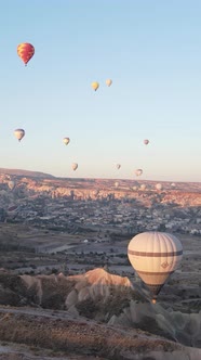 Vertical Video of Hot Air Balloons Flying in the Sky Over Cappadocia Turkey