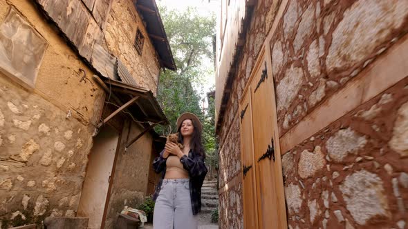 Tourist Woman Looking at Walking With Cat