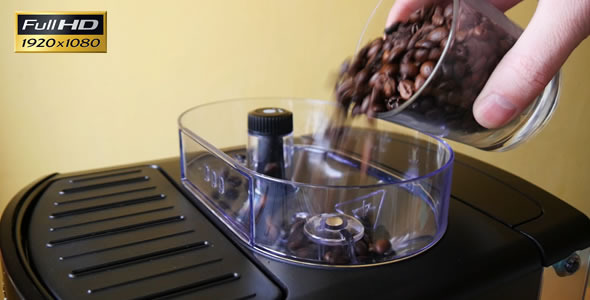 Adding of Roasted Coffee Beans to the Coffee Machi