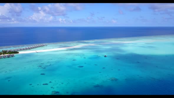 Aerial scenery of exotic coastline beach adventure by blue sea and white sand background of a picnic