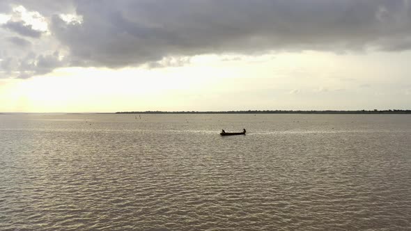 canoe or boat with people crossing river