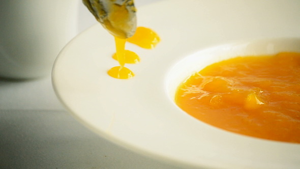 Chef Decorating Recipe with Mango Fruit Sauce