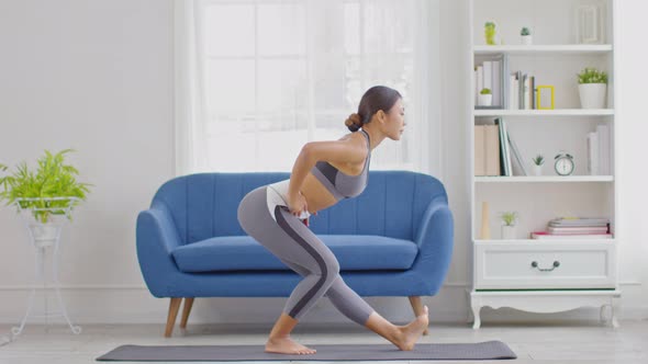 Calm of Asian woman in sportwear stretching muslce to warm up breathing and meditation