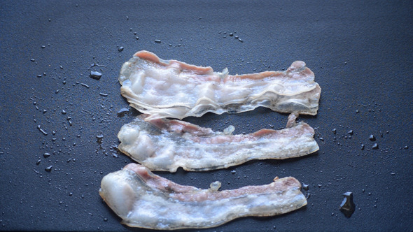 Bacon Strips Shrink As They Cook