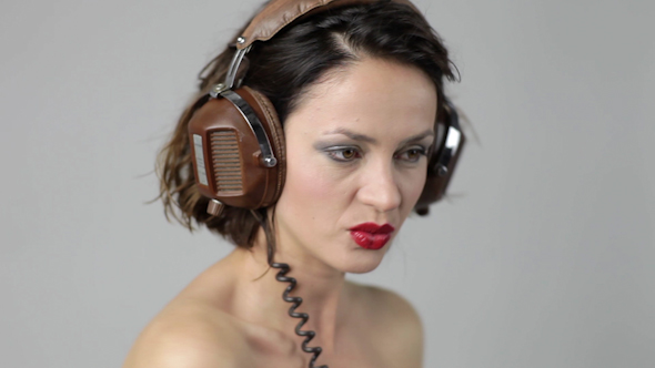 Young Woman Dances And Poses With Headphones 12 alt