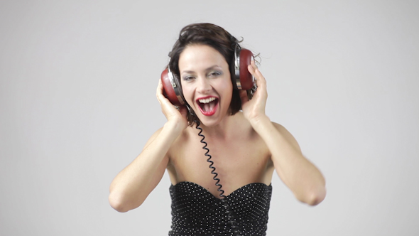 Young Woman Dances And Poses With Headphones 2