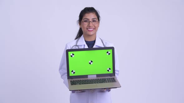 Young Happy Persian Woman Doctor Showing Laptop