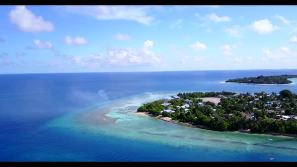 Aerial top view seascape of luxury bay beach break by blue green lagoon with white sand background o