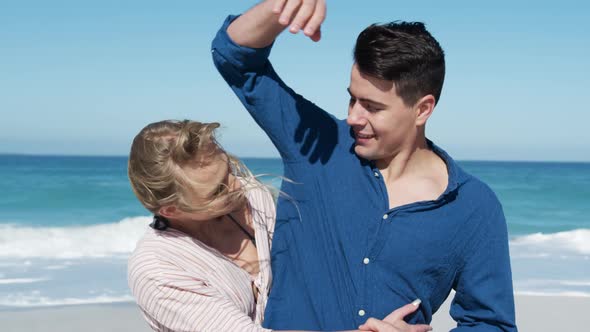 Couple in love enjoying free time on the beach together