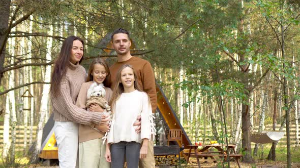 Beautiful Family Walking at Autumn Warm Day