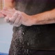 A sportsman is dusting hands with sport magnesia, close-up of arms, slow motion. - VideoHive Item for Sale