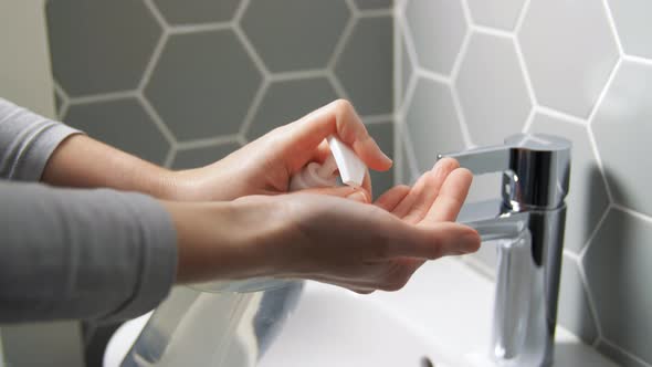 Close Up of Woman Washing Hands with Liquid Soap