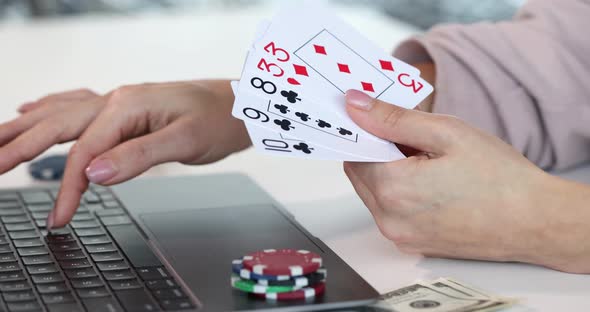 Professional Player Plays Online Poker on Internet Closeup