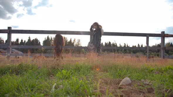 Woman and and Horse in Ranch Field