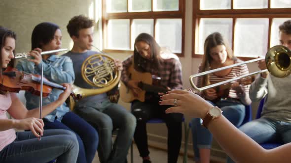 Teenage musicians rehearsing
