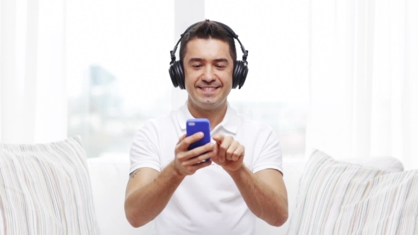 Happy Man With Smartphone And Headphones