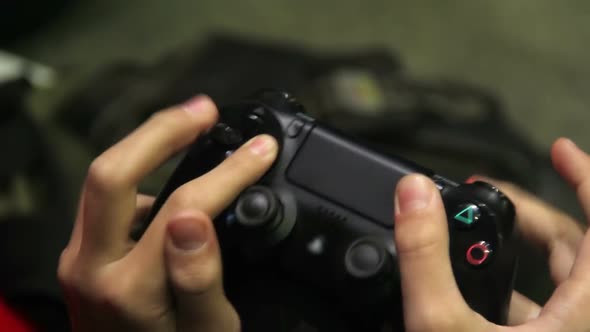 Gaming Addict Pushing Buttons on Joypad, Boy Playing Shooting Simulation Game