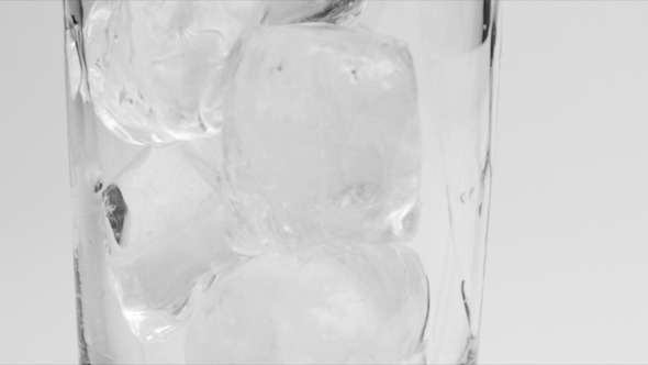 Dropping Ice Cubes in a Glass