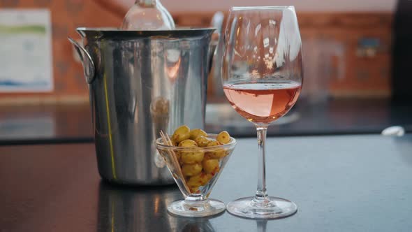 Party Dinner Table. Glass of Rose Wine on Restaurant Table Sunset Cafe