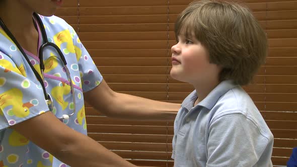 Nurse Checks Young Child's Glands