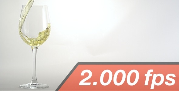 White Wine is Pouring into a Wine Glass