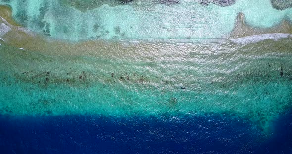 Luxury overhead clean view of a white paradise beach and turquoise sea background