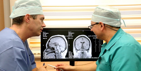 Two Doctors Examining CT Scan
