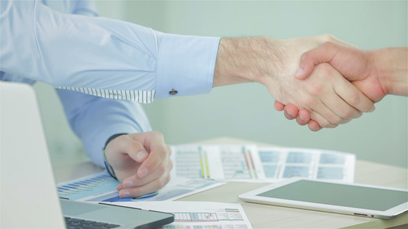 Two Businessman Shaking Hands Greeting Each Other