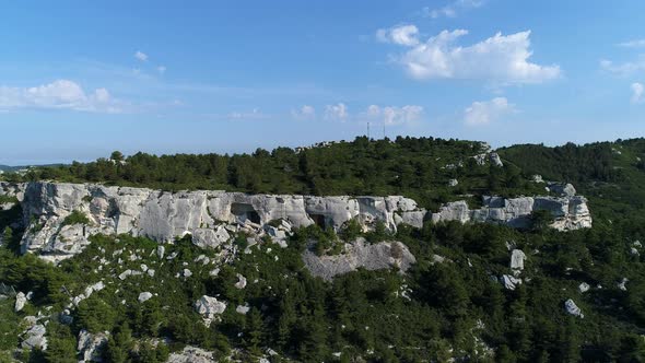 Cave dwellings of the Alpilles massif in France seen from the sky