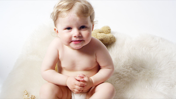 Cute Blonde Baby on a Rug