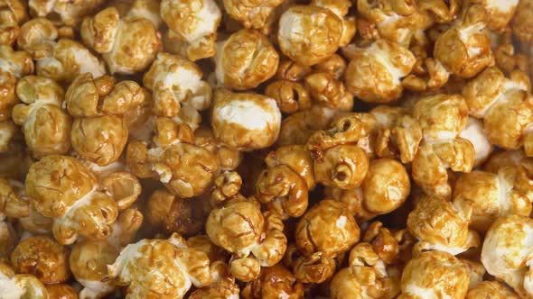 Coffee taste hot popcorn with smoke rotating close up. Caramel popcorn. Healthy food for morning