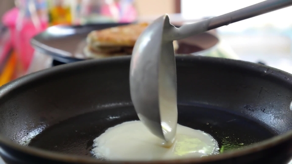 Baking Pancake From Batter In a Frying Pan. Close