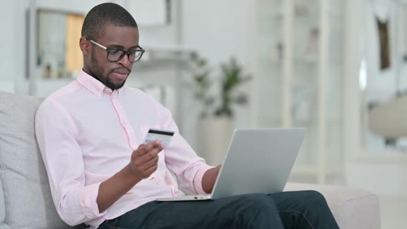 Unsuccessful Online Payment on Laptop By African Man at Home