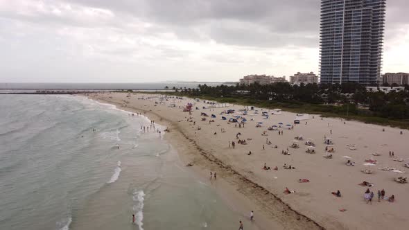 College Crowds Gathering On Miami Beach Aerial Drone Video