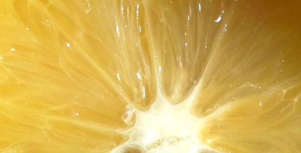 Squeezing An Orange For Making Fresh Juice alt