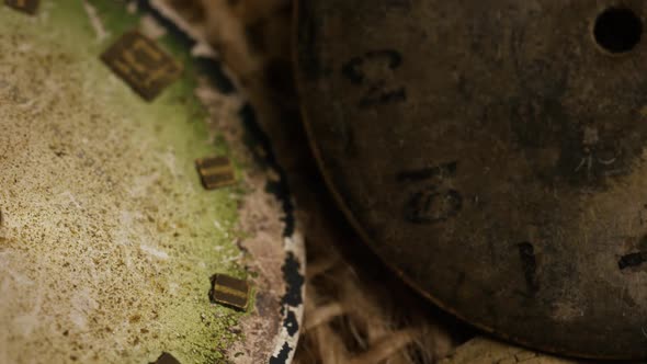 Rotating stock footage shot of antique and weathered watch faces 