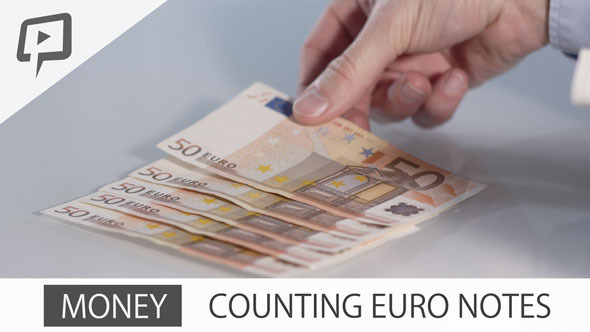 Money counting Euro Notes on Table