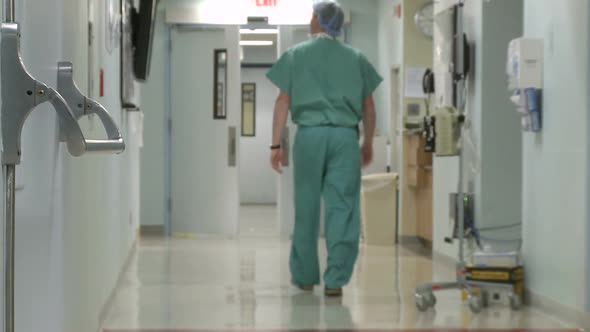 Hospital Staff Moving Through Hallway (1 Of 3)