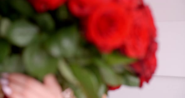 Sexy Woman In Underwear Smelling A Rose Bouquet alt